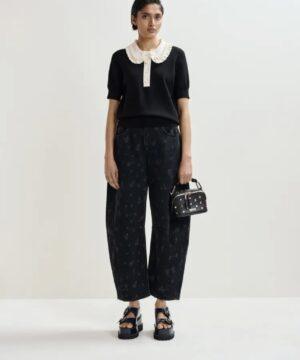 ESSENTIEL ANTWERP Polo en maille fine noir et blanc cassé à volants et perles Boutique rive gauche Belfort