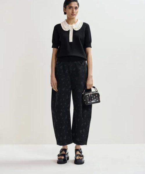 ESSENTIEL ANTWERP Polo en maille fine noir et blanc cassé à volants et perles Boutique rive gauche Belfort