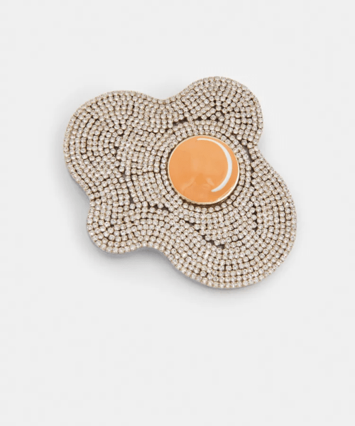 Broche en forme d'œuf ornée de strass crème et jaune